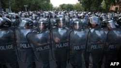 Armenia -- Police block a street during a protest against an increase of electricity prices in Yerevan, June 23, 2015